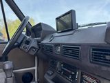 a car dashboard with a monitor and other electronics in it
