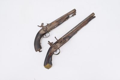 two antique pistols on a white background