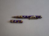 two pens that are sitting on a table