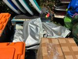 many different types of surfboards in a pile