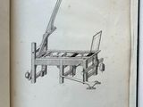 an open book with a drawing of a machine on it
