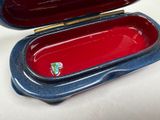 a blue and red case with a toothbrush inside of it