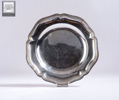 a silver plate that is sitting on a table