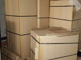 many boxes stacked on top of each other in the kitchen