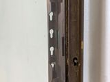 a close up of a door handle on a glass door