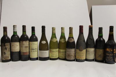 many bottles of wine lined up on a white table