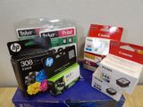 many different ink cartridges sitting on top of each other