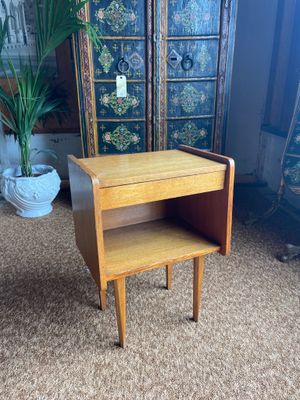 an image of a small wooden table with a shelf underneath it