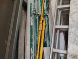 a pile of construction materials in a room with a ladder