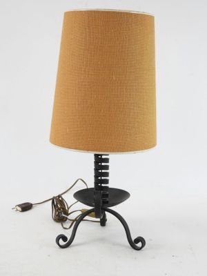 an image of a table lamp with a brown shade on it