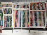 many different colors of paint on the shelves in the store