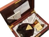 a wooden box with a bottle of liquor in it