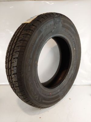 a close up of a tire on a white surface
