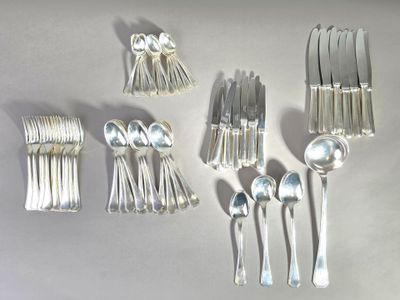 a lot of silver spoons and spoons on a table