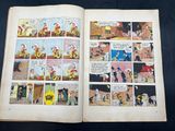an open comic book with a comic strip and a comic strip on it
