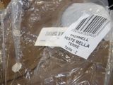 a plastic bag with a label on it sitting on top of a table