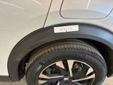a close up of a car tire with a sticker on it