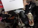a pile of shoes and shoes that are in a basket