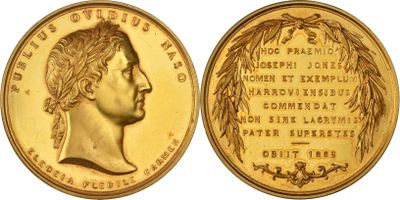 a close up of a gold coin with a woman ' s face on it