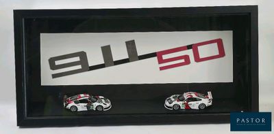 a picture of a picture of two cars in a shadow box
