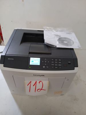 une photo d'une imprimante sur laquelle est apposée une étiquette de prix