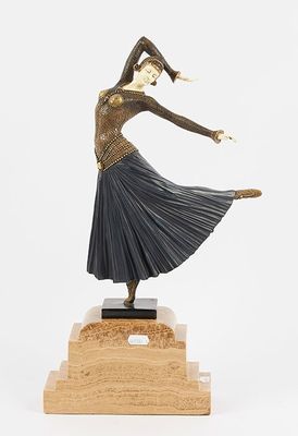 an image of a bronze statue of a woman dancing on a wooden base