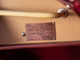 a close up of a leather bag with a label on it