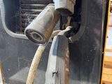 an image of a close up of a machine with a hose attached to it