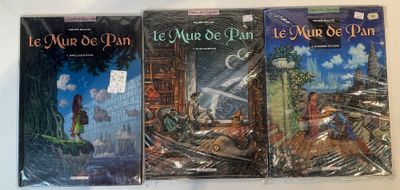 three books are lined up on a table with a white background