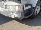 a white truck that is parked on the side of the road