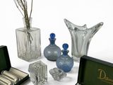 a lot of glass items that are sitting on a table