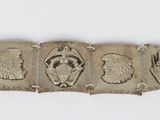a silver bracelet that has five different designs on it