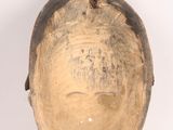 an image of a wooden mask on a white background