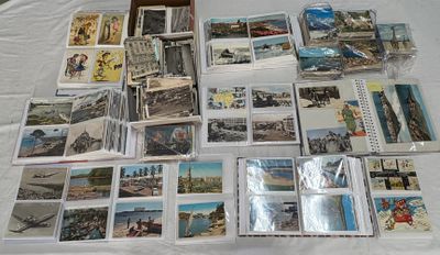 a lot of postcards on a table with a box of them