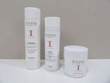 two bottles of hair products sitting on a white surface