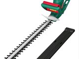 a close up of a hedger with a green and red trimmer