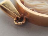 a close up of a bowl of noodles and a spoon