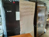 two refrigerators and a refrigerator freezer in a room