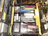 a yellow tool box filled with tools on the side of a truck