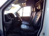 a white van with black leather seats in the back of it