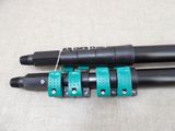 two black and blue pens sitting next to each other on top of a table