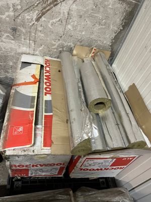 a box of rolls of insulation next to a box of rolls of insulation