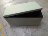 a box that has a lid on it on the floor