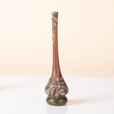 two vases that are sitting on a white table