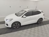 the white car is parked in the garage on the checkered floor