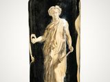black and white vase with a statue of a woman holding a staff