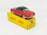 a red toy car sitting on top of a yellow box