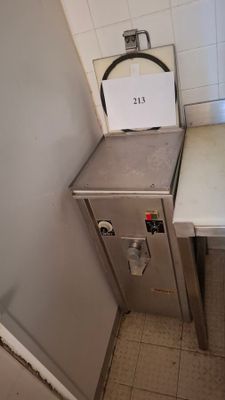 an image of a small kitchen with a sink and a stove