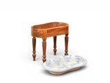 a small wooden table with a bowl on top of it
