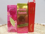 two boxes of candy sunset next to each other on a table